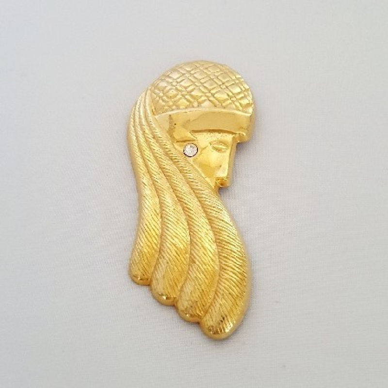 Goudkleurige broche vrouwenhoofd